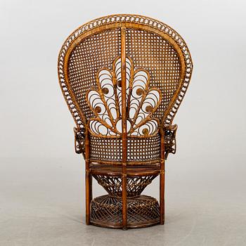 A RATTAN ARMCHAIR.
