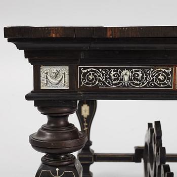 A Renaissance-style ebony, ebonized and ivory-inlaid library table, late 19th century, presumably Germany.