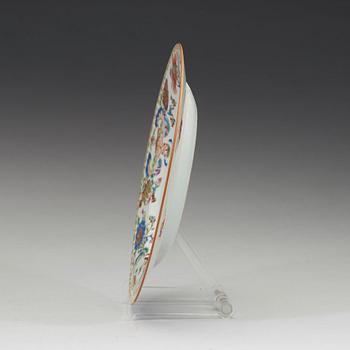 An export porcelain 'Pompadour' armorial plate, Qing Dynasty, circa 1745.