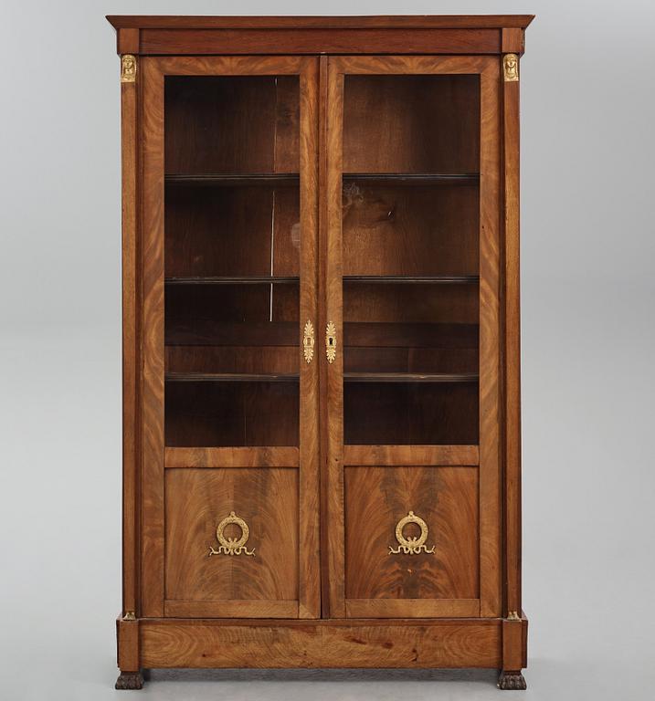 A French Empire mahogany and gilt-bronze mounted bibliothèque, early 19th century.