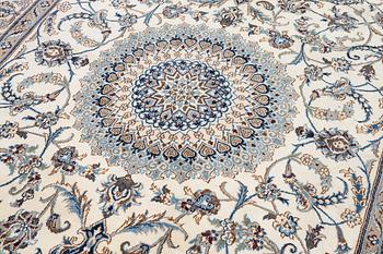 An Oriental carpet, approx. 354 x 243 cm.