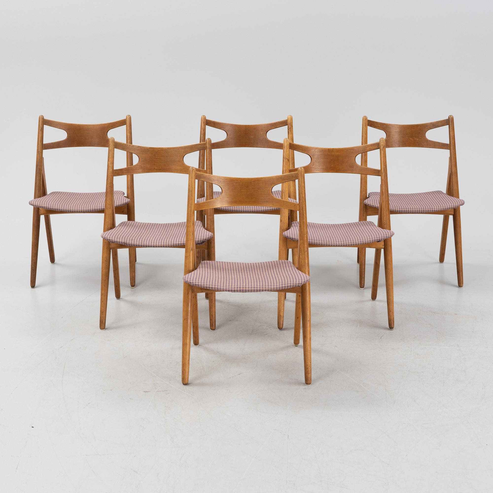 A set of six model CH 29 'Savbukstolen' by Hans J Wegner, designed 1952.