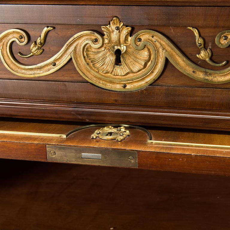 A 20th-century Louis XVI style mahogany veneered writing desk.