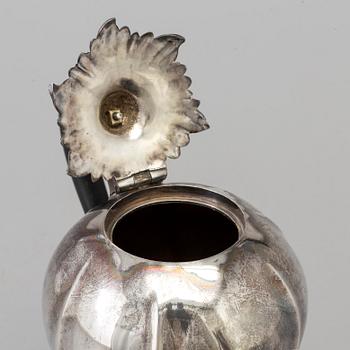 A bulbous silver coffeepot maker's mark Charles Stuart Harris, London, 1893.