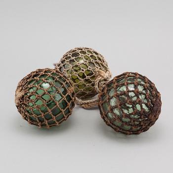 Three glass floats, 20th century.