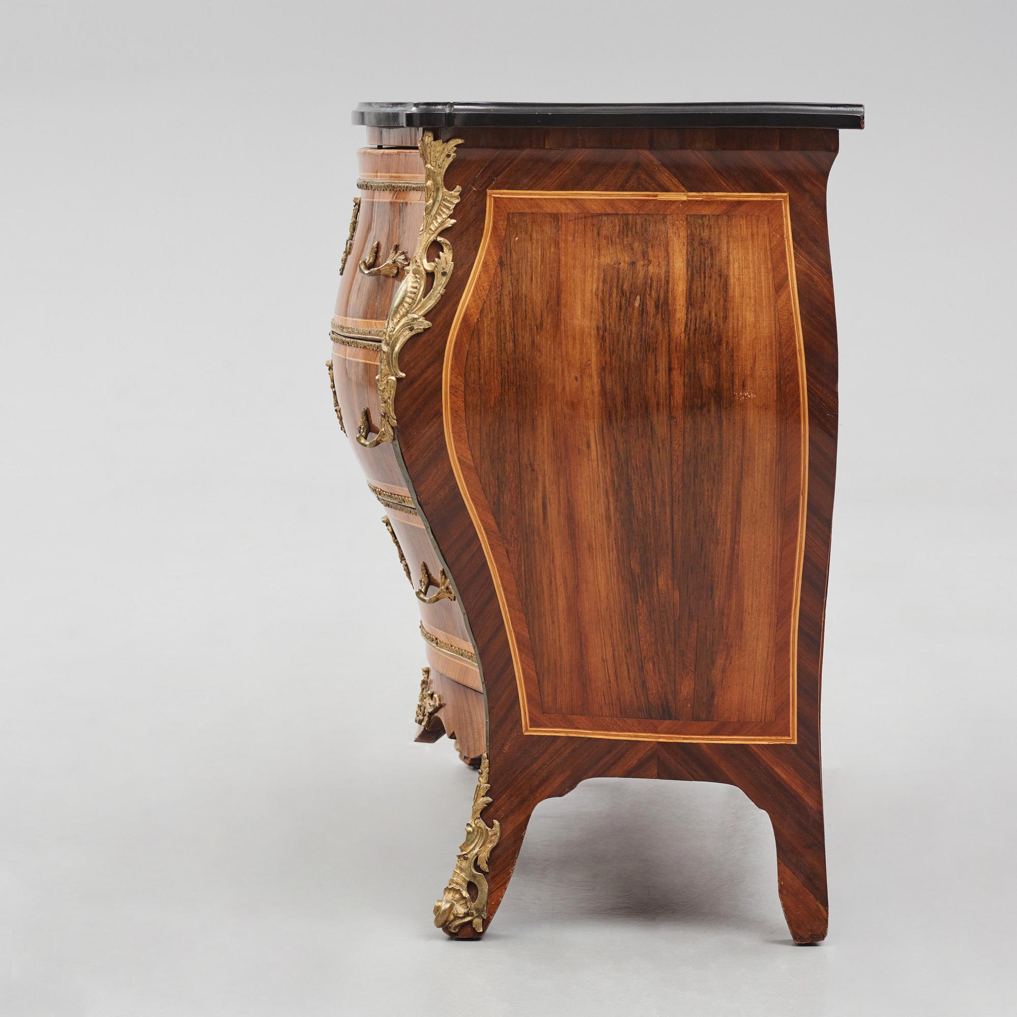 A rococo parquetry and gilt brass-mounted commode possibly by C. Åhman (master in Stockholm 1748-1783).