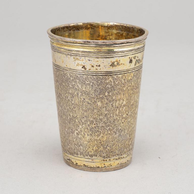 A German 17th century parcel-gilt silver beaker, unmarked. With later owners mark.