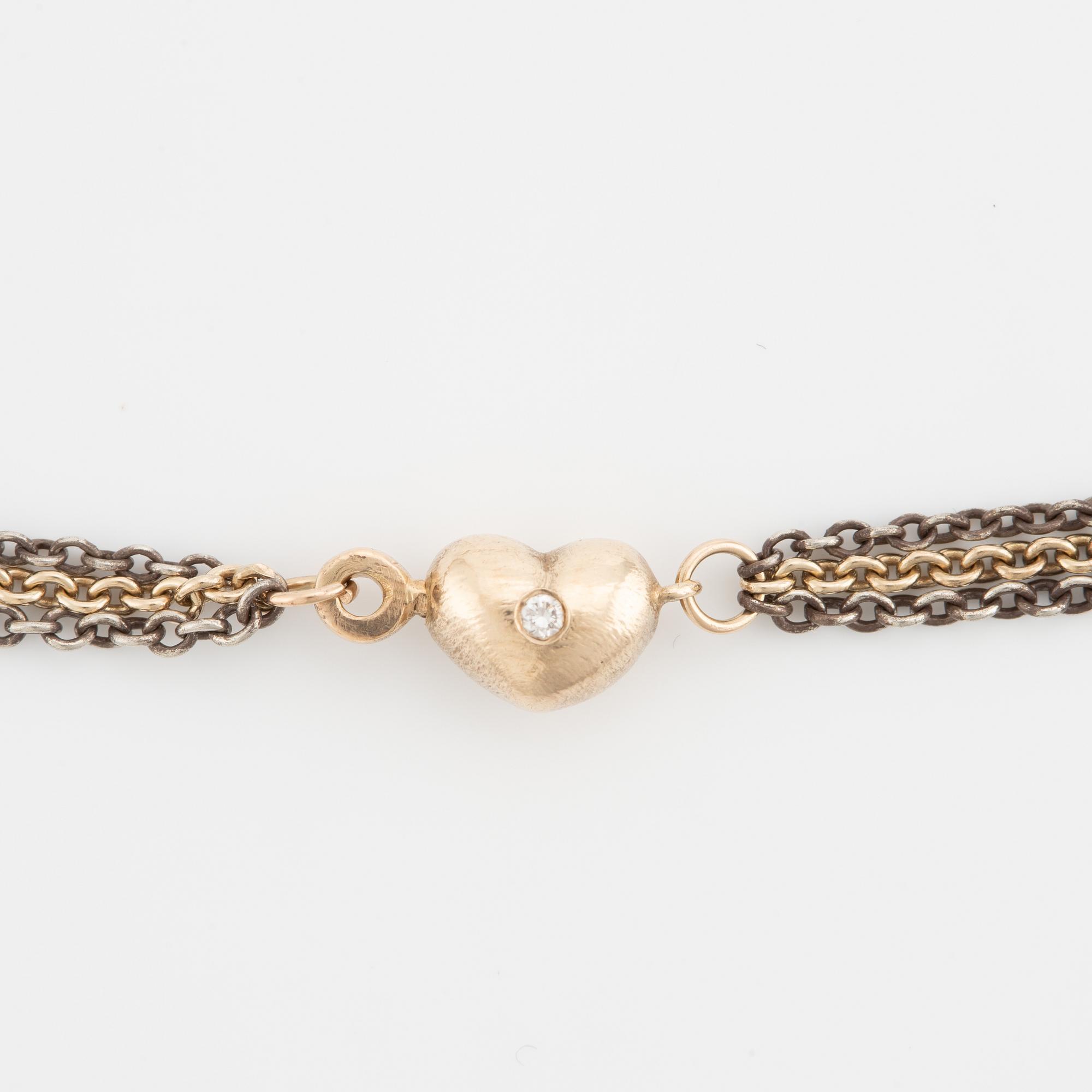 Ole Lynggaard, collier, 14K guld, hjärtformat lås med briljantslipade diamanter.