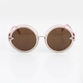 Karen Walker, a pair of pink "Orbit" sunglasses.