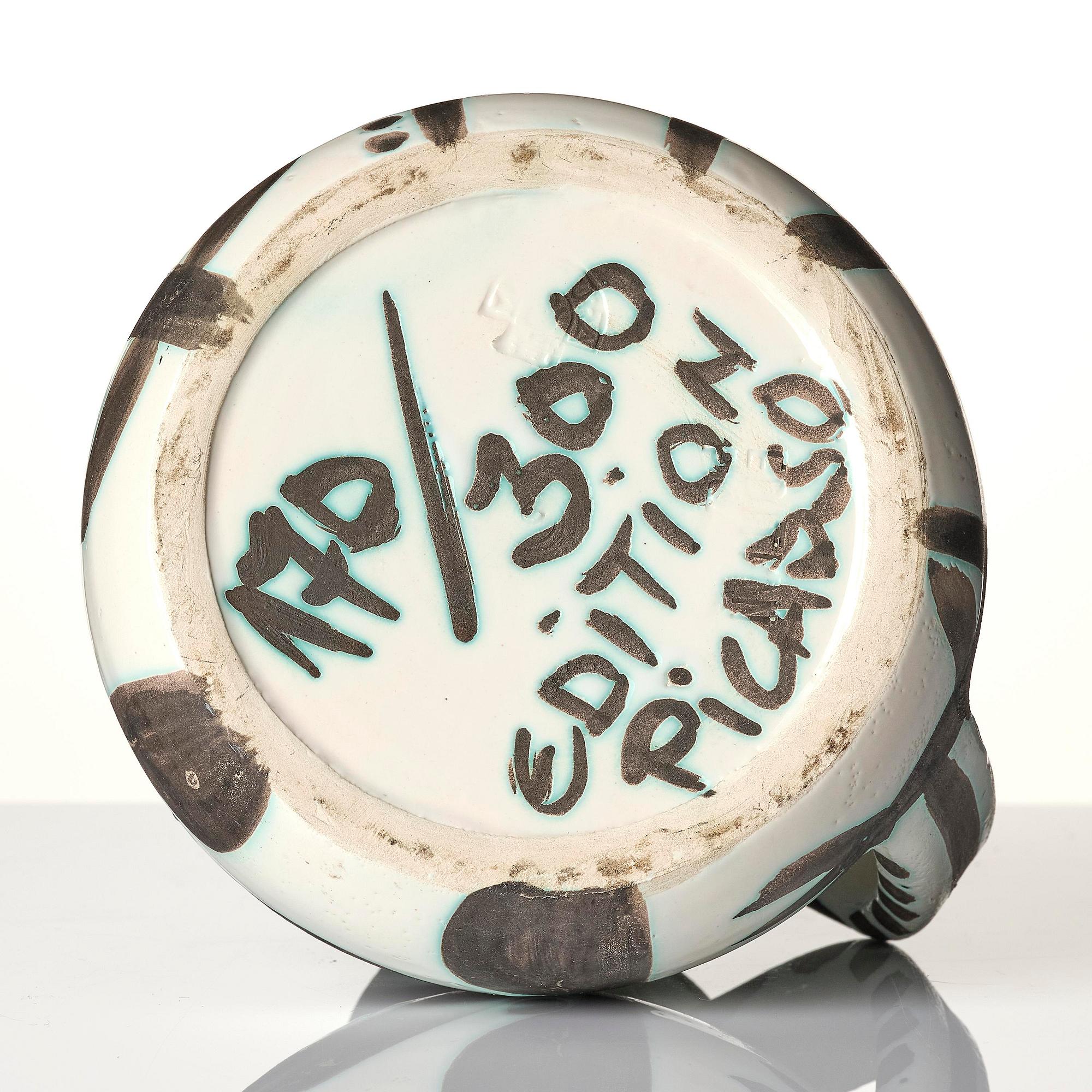 Pablo Picasso, a "Pichet petites têtes" (A.R. 222) faience pitcher, Madoura, Vallauris, France, post 1953.