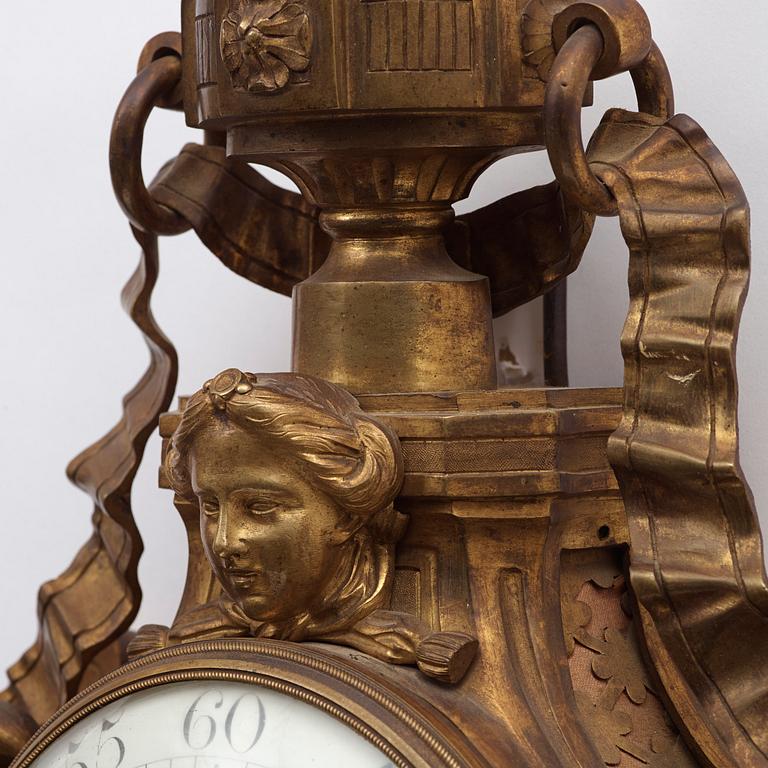 A Louis XVI 18th century gilt bronze wall clock by Cellier.