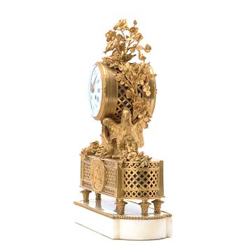 A Louis XVI-style late 19th century mantel clock by Eugene Hazart (1838-1891, bronze maker in Paris).