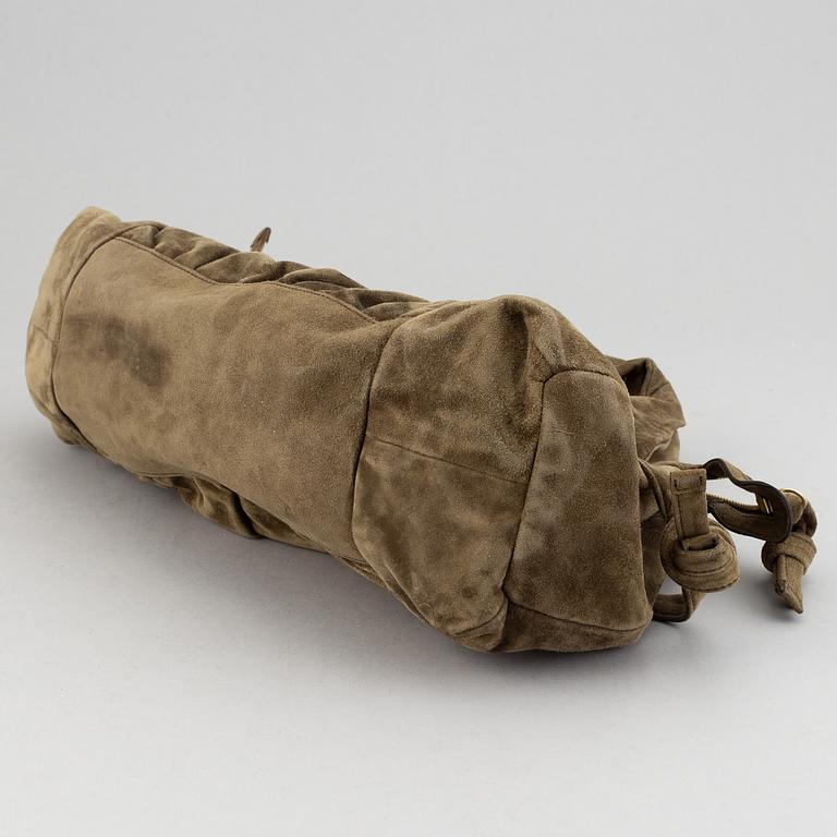Gucci, a suede bag.