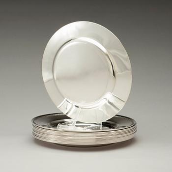 A set of 12 silver dinner plates by Guldsmedsaktiebolaget, Stockholm 1952-55.