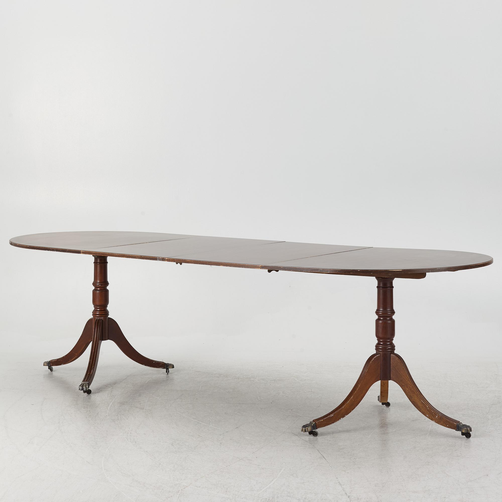 A dining table, 20th century, England.