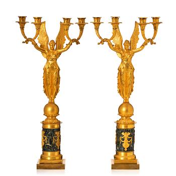 133. A pair of French Empire four-light candelabra, attributed to Francois Rabiat (bronze maker in Paris 1756-1815).