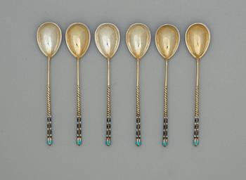 A set of six Russian 19th century silver-gilt and enamle tea-spoons, unidentified makers mark, St. Petersburg.