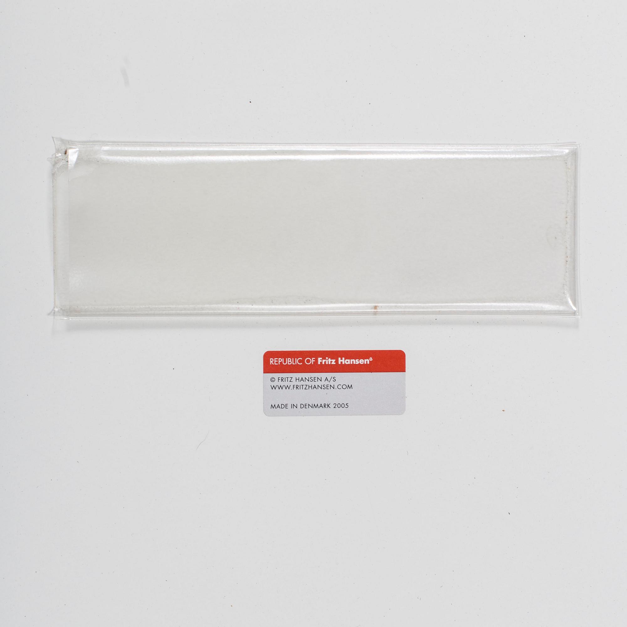 A TABLE BY BRUNO MATHSSON, PIET HEIN & ARNE JACOBSEN FOR FRITZ HANSEN.