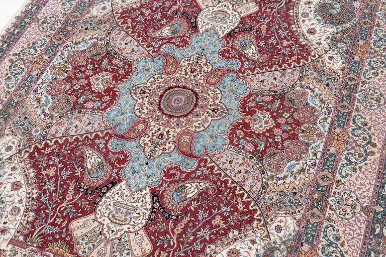 A Tabriz carpet, 210 x 195 cm. signed.