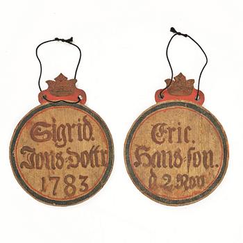 A pair of Swedish painted name plaques, one dated 1783.
