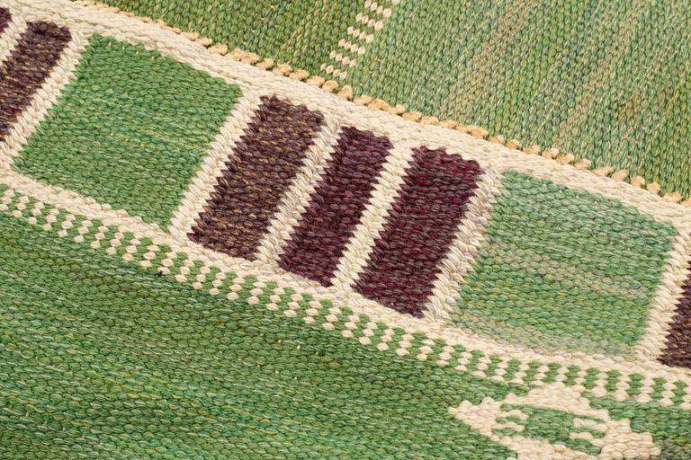 Barbro Nilsson, a carpet, "Salerno grön med enkel bård", flat weave, ca 295 x 197-198,5 cm, signed AB MMF BN.