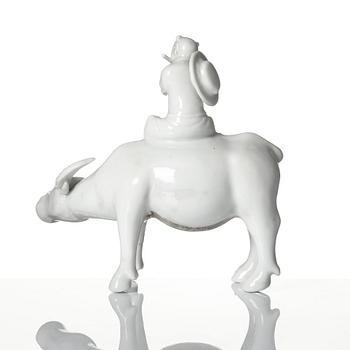 A blanc de chine figure of a boy on an ox, late Qing dynasty.