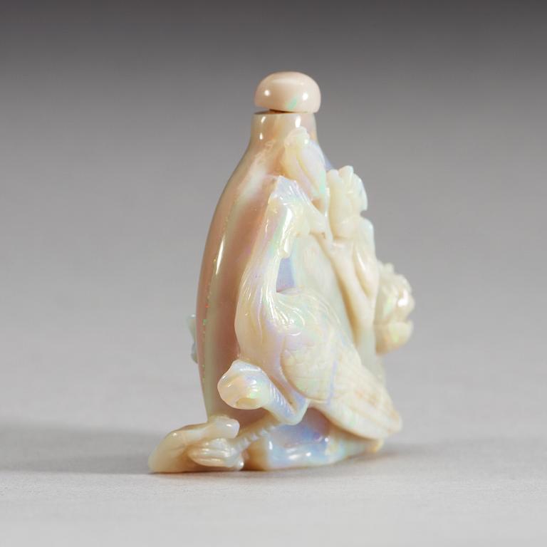 A carved snuff bottle, presumably opal.