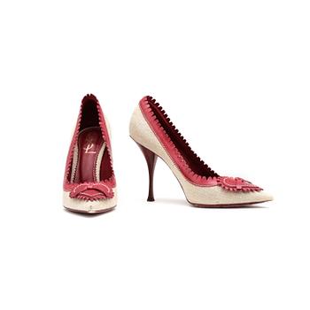 855. YVES SAINT LAURENT, a pair of red leather and canvas pumps.