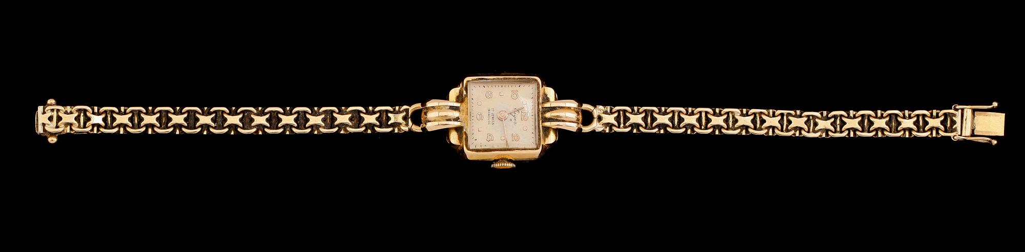 DAMARMBANDSUR, 18 k guld, Eiger, 1900-talets mitt. Total vikt inkl ur ca 21,4 g.