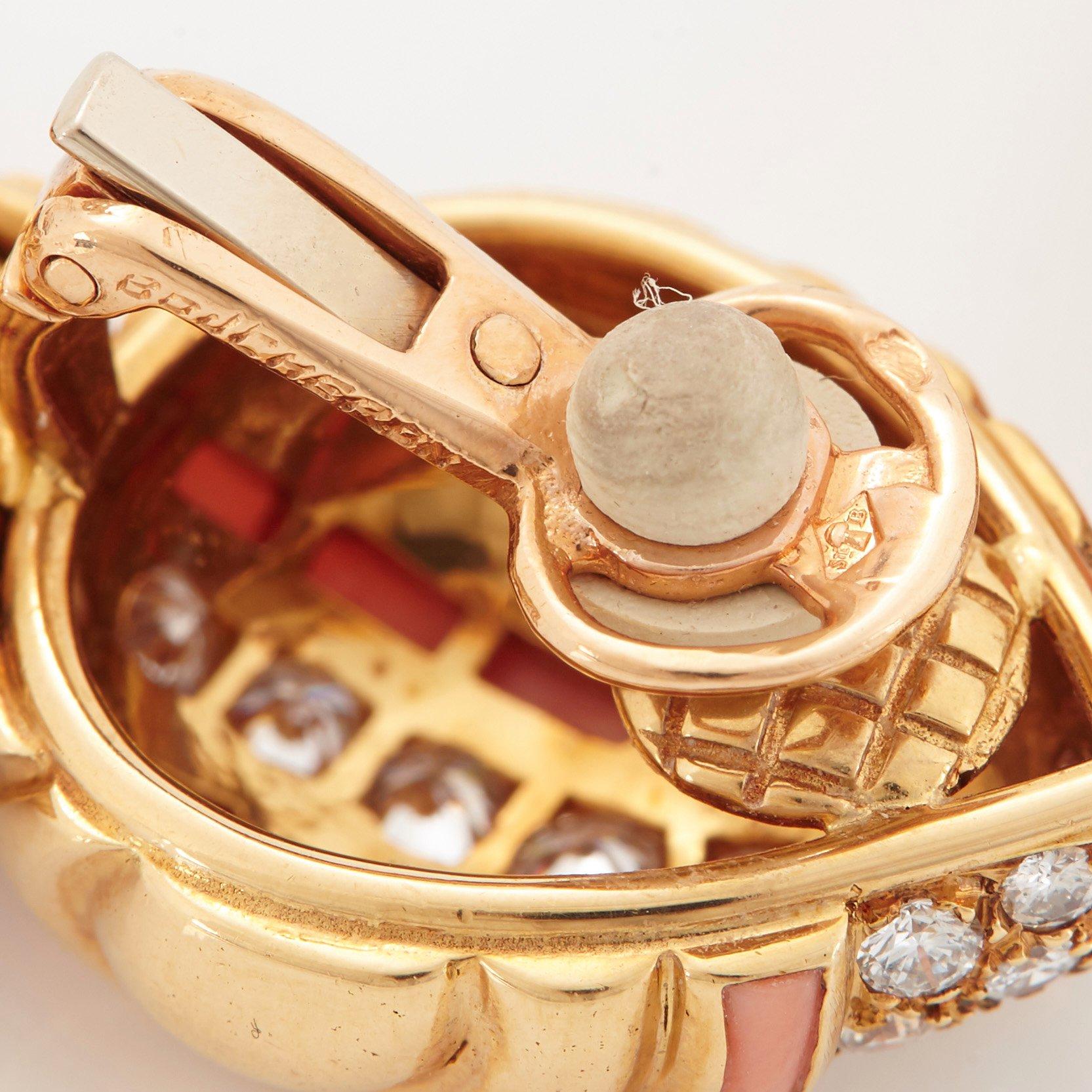 A pair of 18K gold Boucheron earrings set with round brilliant-cut diamonds and coral.