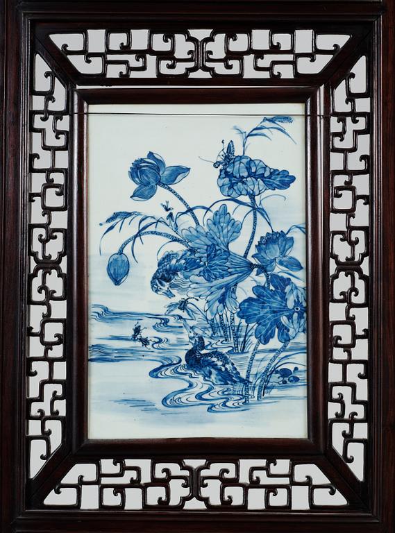 A four panel screen with porcelain placques, Qing dynasty, 19th Century.