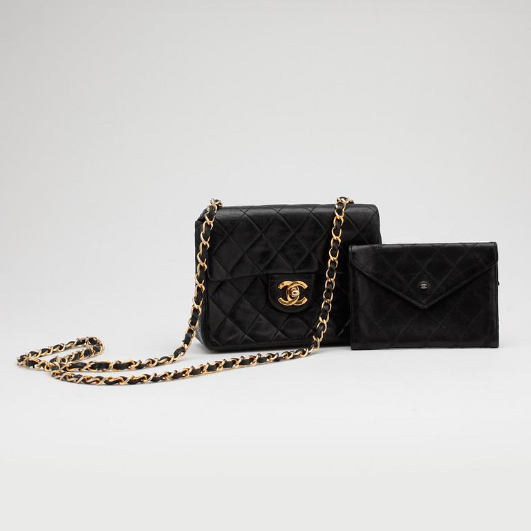 CHANEL, a black quilted leather "Mini flap" bag and wallet.