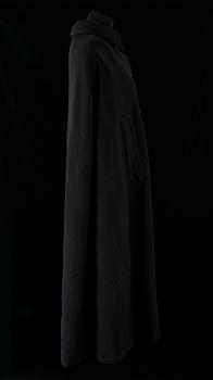 A black 1960s/70s cape by Hermès.