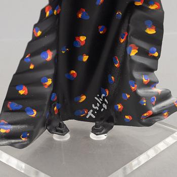 Timo Solin, Woman in patterned dress.