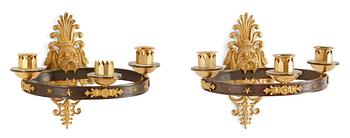 727. A pair of French Empire early 19th Century three-light wall-lights.
