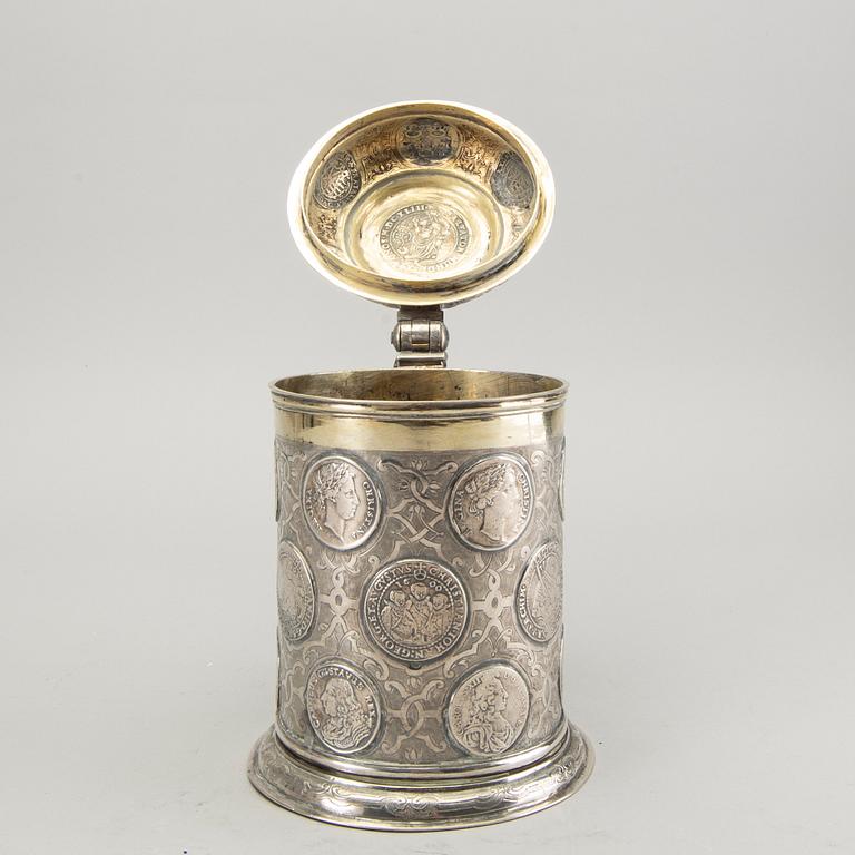 A German 18th century parcel-gilt silver coin-tankard, mark of Johann Friedrich Beyer, Schweidnitz (1736-1775).