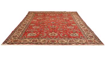 AN old Tabriz carpet ca  310 x 207 cm.