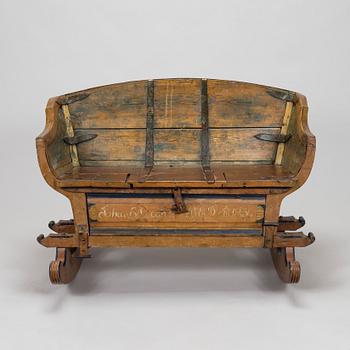 A 19th-century wooden sleigh.