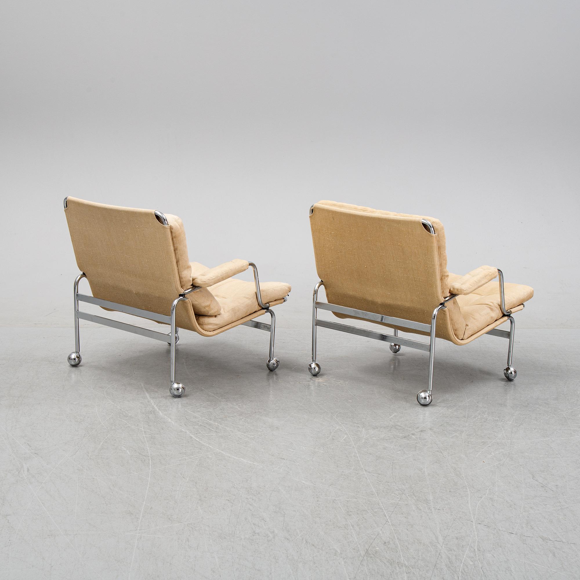 Bruno Mathsson, a pair of easy chairs and a coffee table, 'Karin', Dux, second half of the 20th Century.