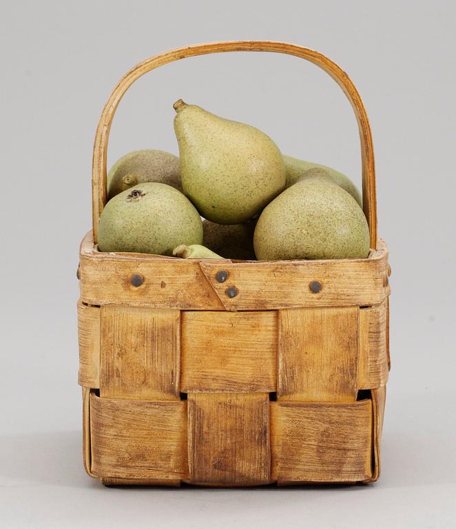 An Ingrid Herrlin stoneware basket with 14 pears.