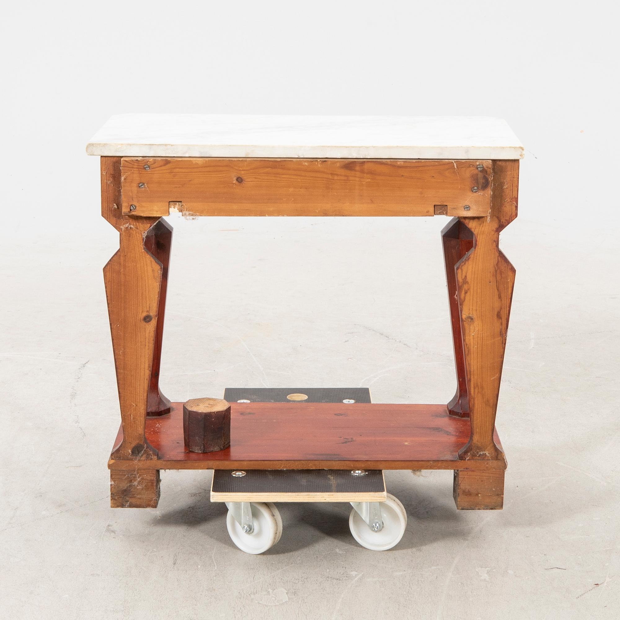 An empire style console table first half of the 20th century.