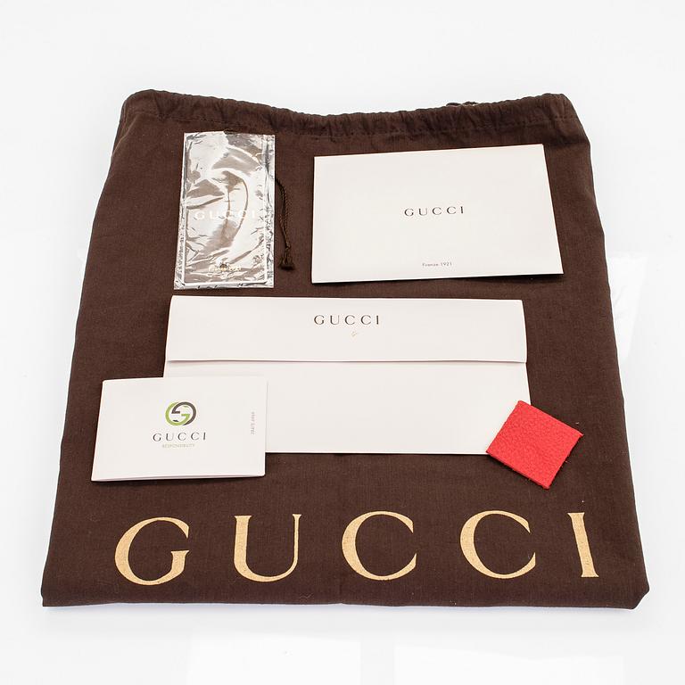 Gucci, a 'Swing Tote Medium' bag.