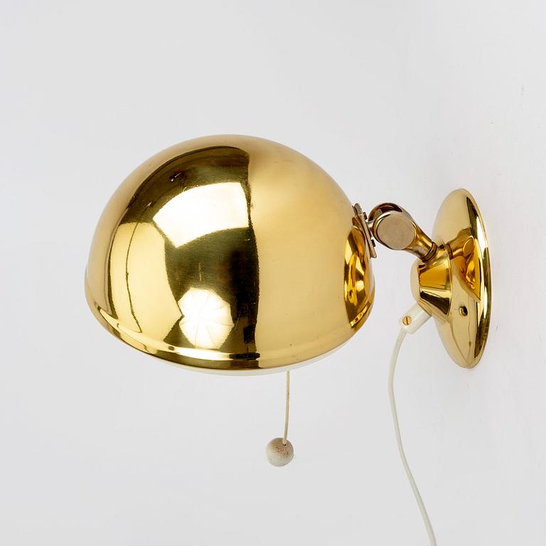 A pair of brass wall lamps by Knud Christensen for Elit, Denmark middle of the 20th century.