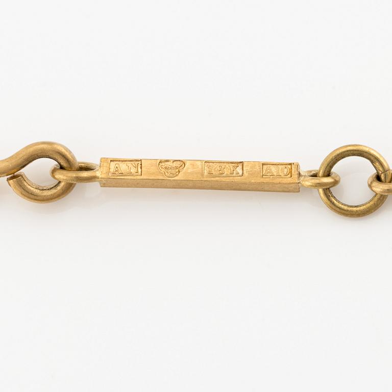 Wiwen Nilsson, an 18K gold necklace with a rock crystal pendant, Lund 1975.