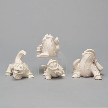 Wilhelm Kåge, a set of 4 stoneware figures of 'dragon puppies' Gustavsberg, Sweden 1940's.