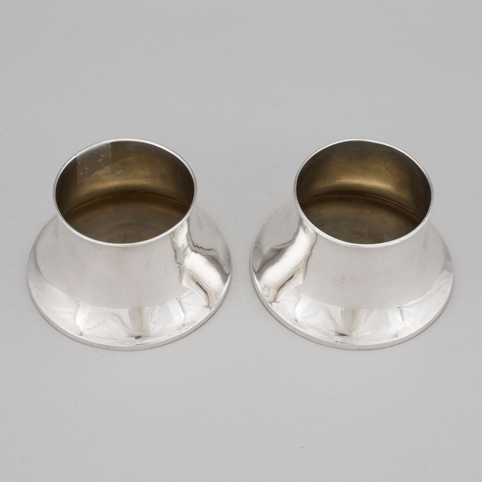 COASTERS / bottle holder , a pair of silver , gilt interior , A. Bergman, Stockholm , 1906. Tot weight of 188 grams.