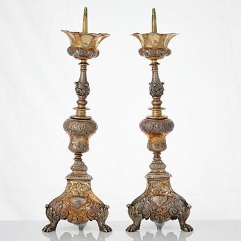 Four Italian 17th/18th century silver-gilt candlesticks, unidentfied makers mark ZP, Venice.