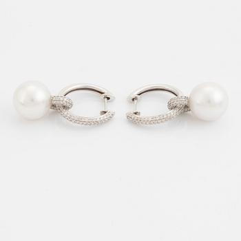 Pearl and brilliant cut diamond earrings.