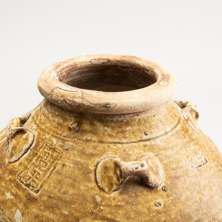 Two olive green glazed South East Asian jars, 14th/17th Century.