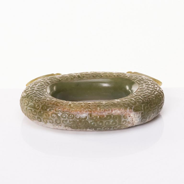 An archaistic sculptured nephrite ring with two cikadas.